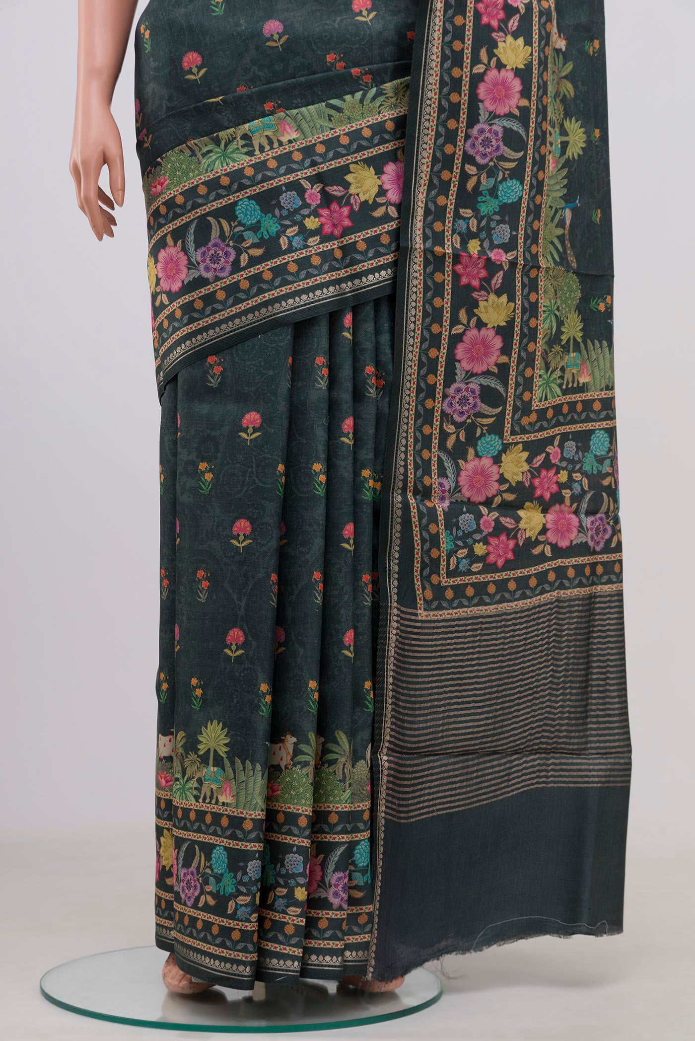 Pleats and pallu of Green Tussar Silk Saree with Fancy on the body and Fancy Border. 