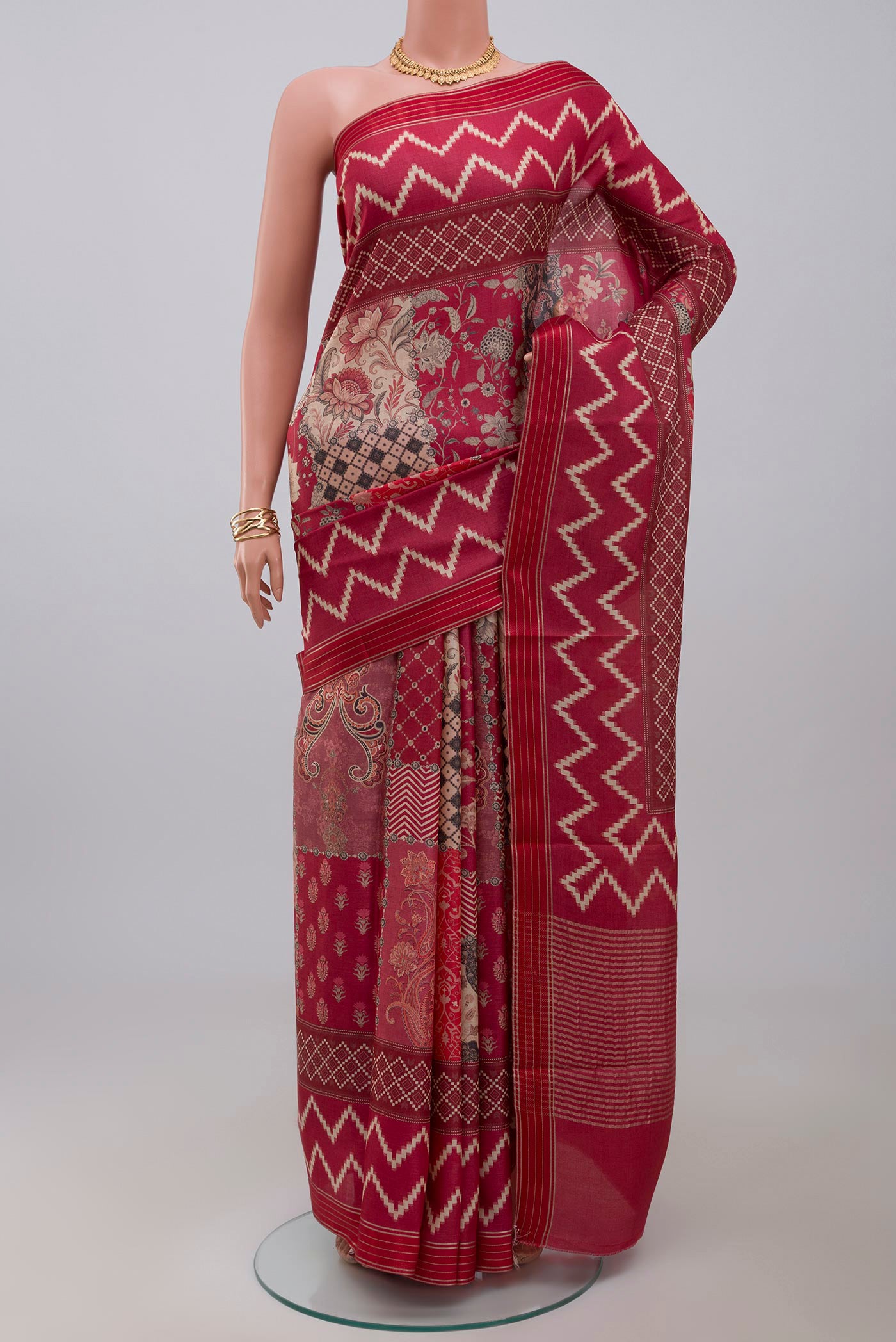 Pink Tussar Silk Saree with Printed design on the body and Thin Zari Line.  displayed on a mannequin