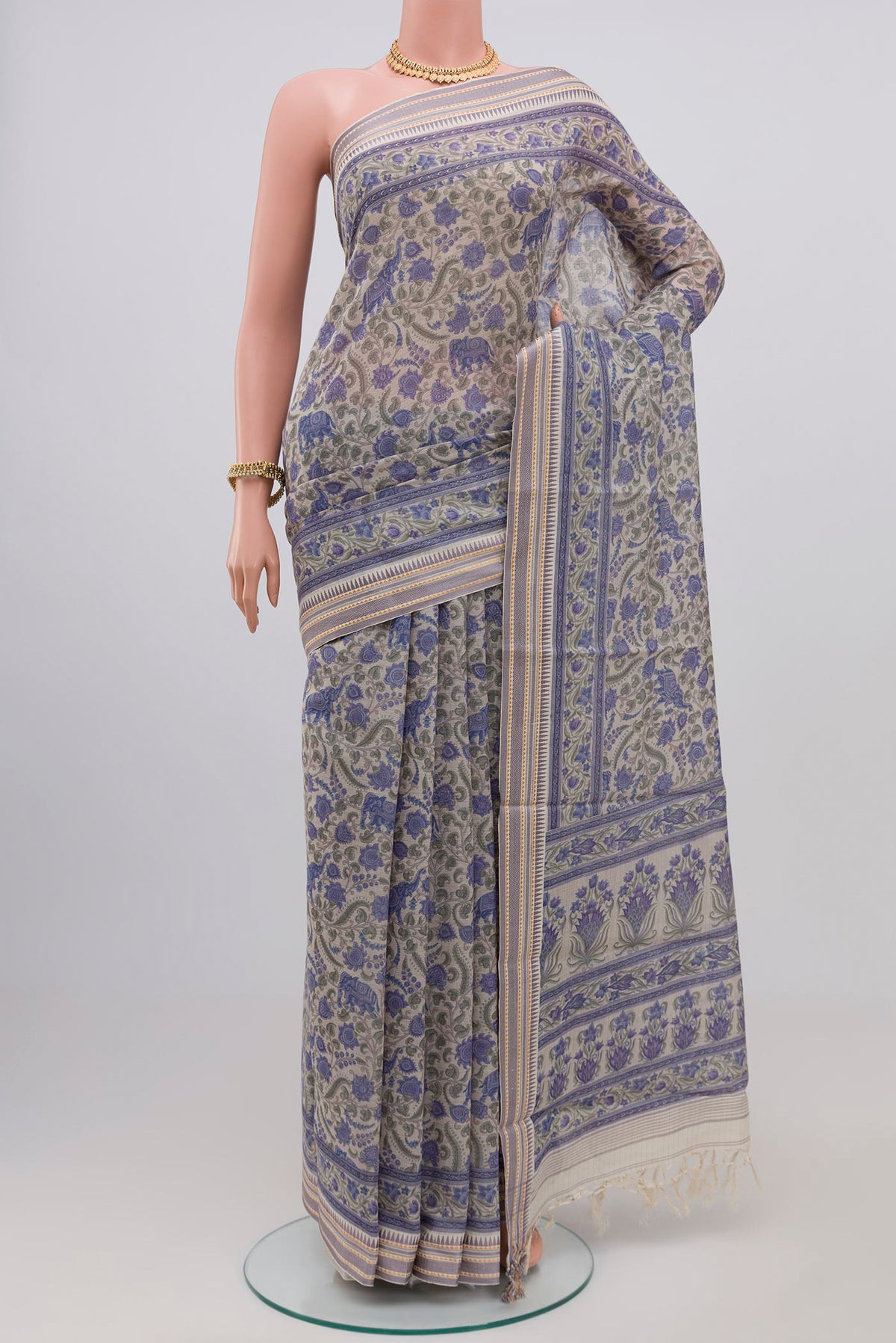Grey Printed Cotton Saree with Printed design on the body and Thread Border.  displayed on a mannequin