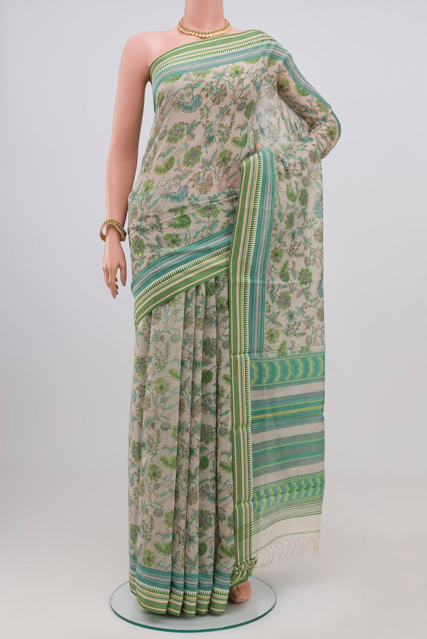 Grey Printed Cotton Saree with Printed design on the body and Thread Border.  displayed on a mannequin