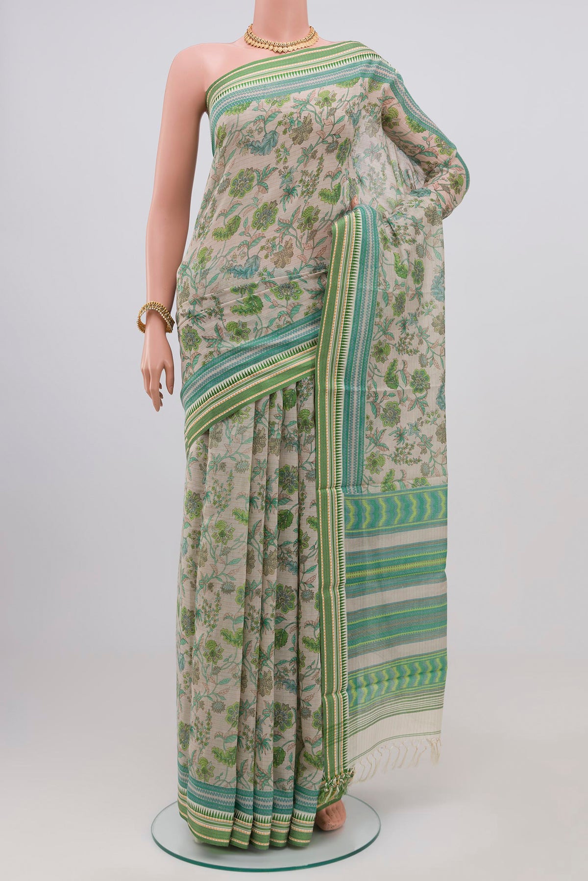Grey Printed Cotton Saree with Printed design on the body and Thread Border.  displayed on a mannequin