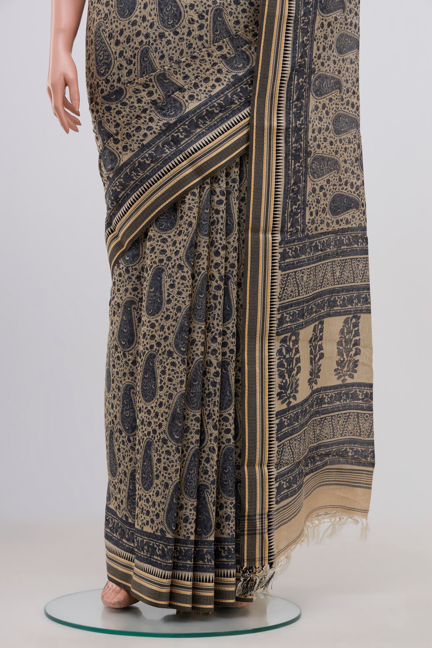 Pleats and pallu of Beige Tussar Saree with Floral Print on the body and Thread Border. 