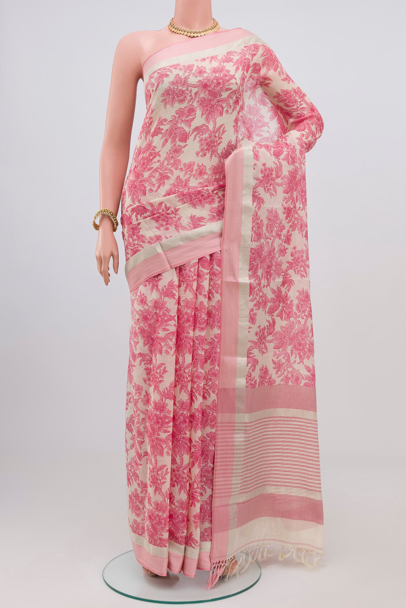 Off White Printed Cotton Saree with Printed design on the body and Thread Border.  displayed on a mannequin