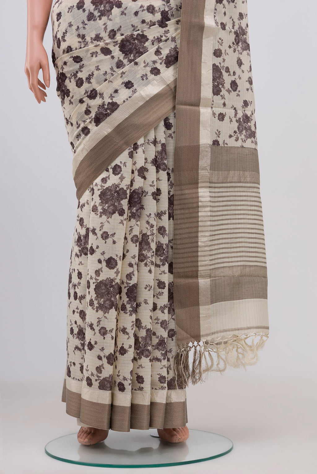Pleats and pallu of Off White Tussar Saree with Floral Print on the body and Zari Border. 