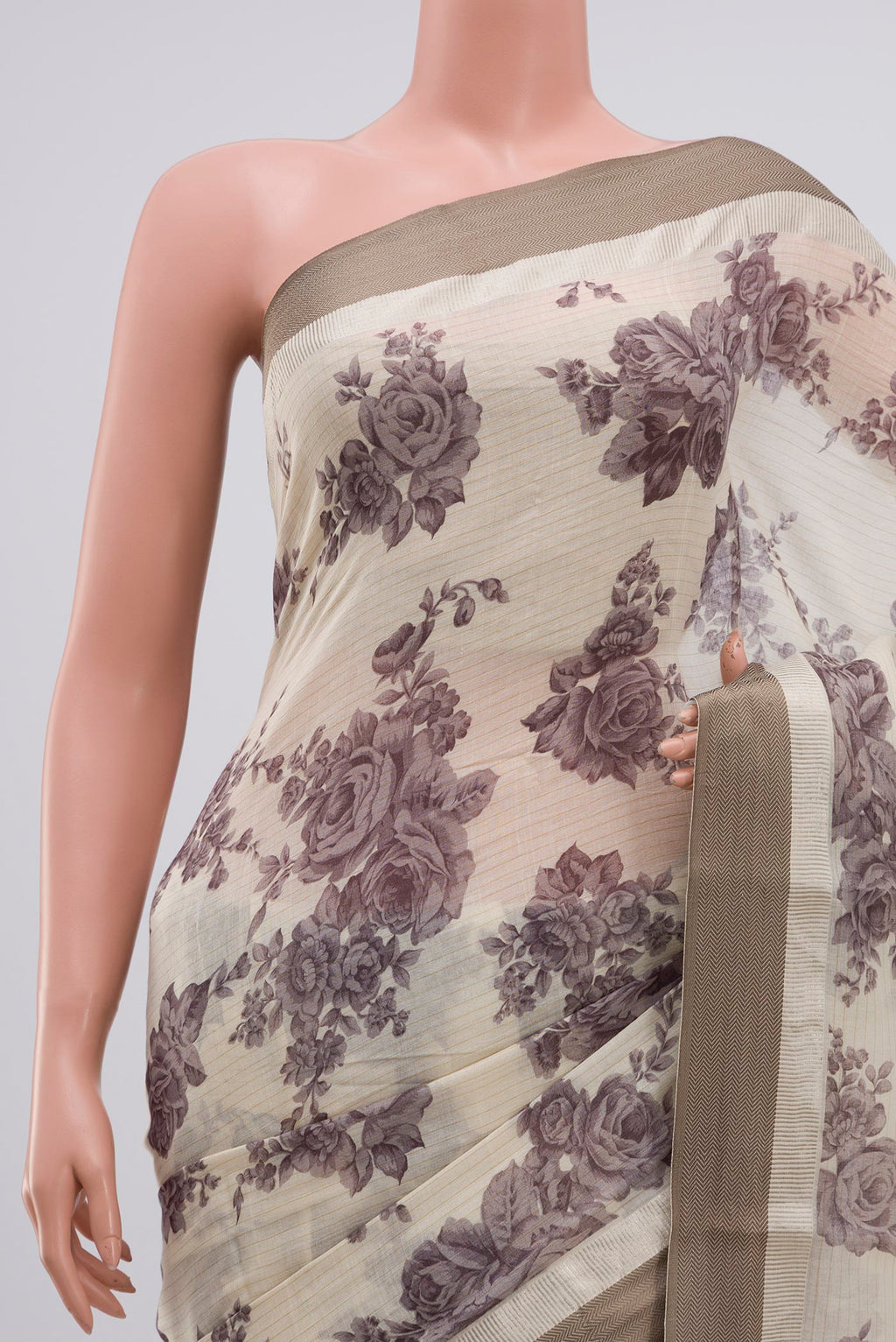 Border image of Beige Tussar Saree with Floral Print on the body and Zari Border. 