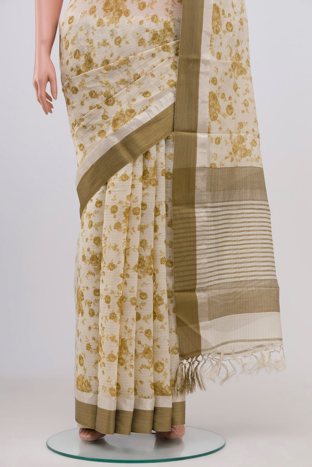 Pleats and pallu of Off White Tussar Saree with Floral Print on the body and Zari Border. 
