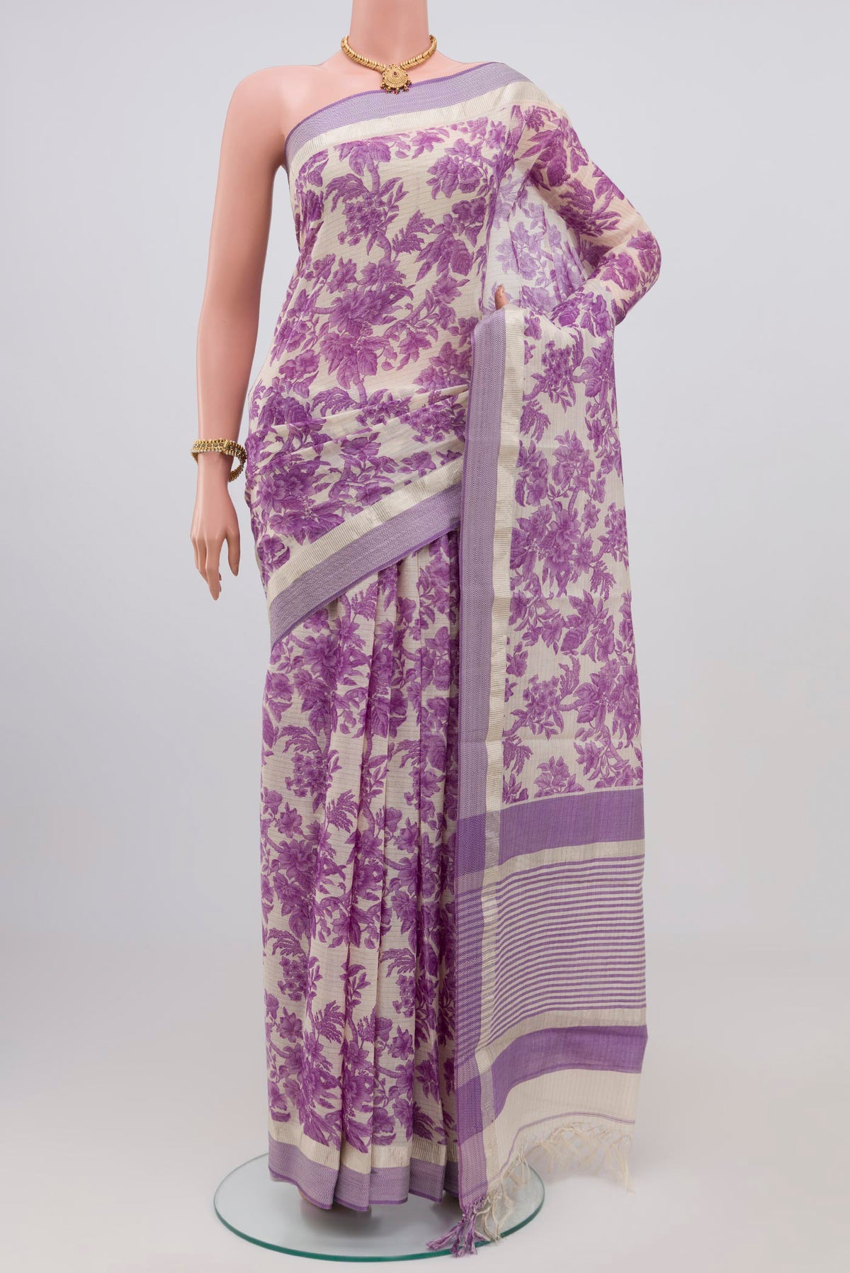 Off White Printed Cotton Saree with Printed design on the body and Thread Border.  displayed on a mannequin
