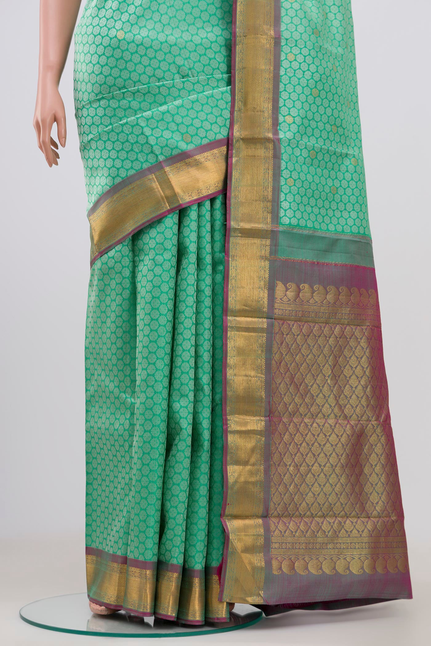 Pleats and pallu of Pure Silk Pure Zari Sea Green Kanjivaram Saree with Jacquard With Zari Butta on the body and Zari Border. 