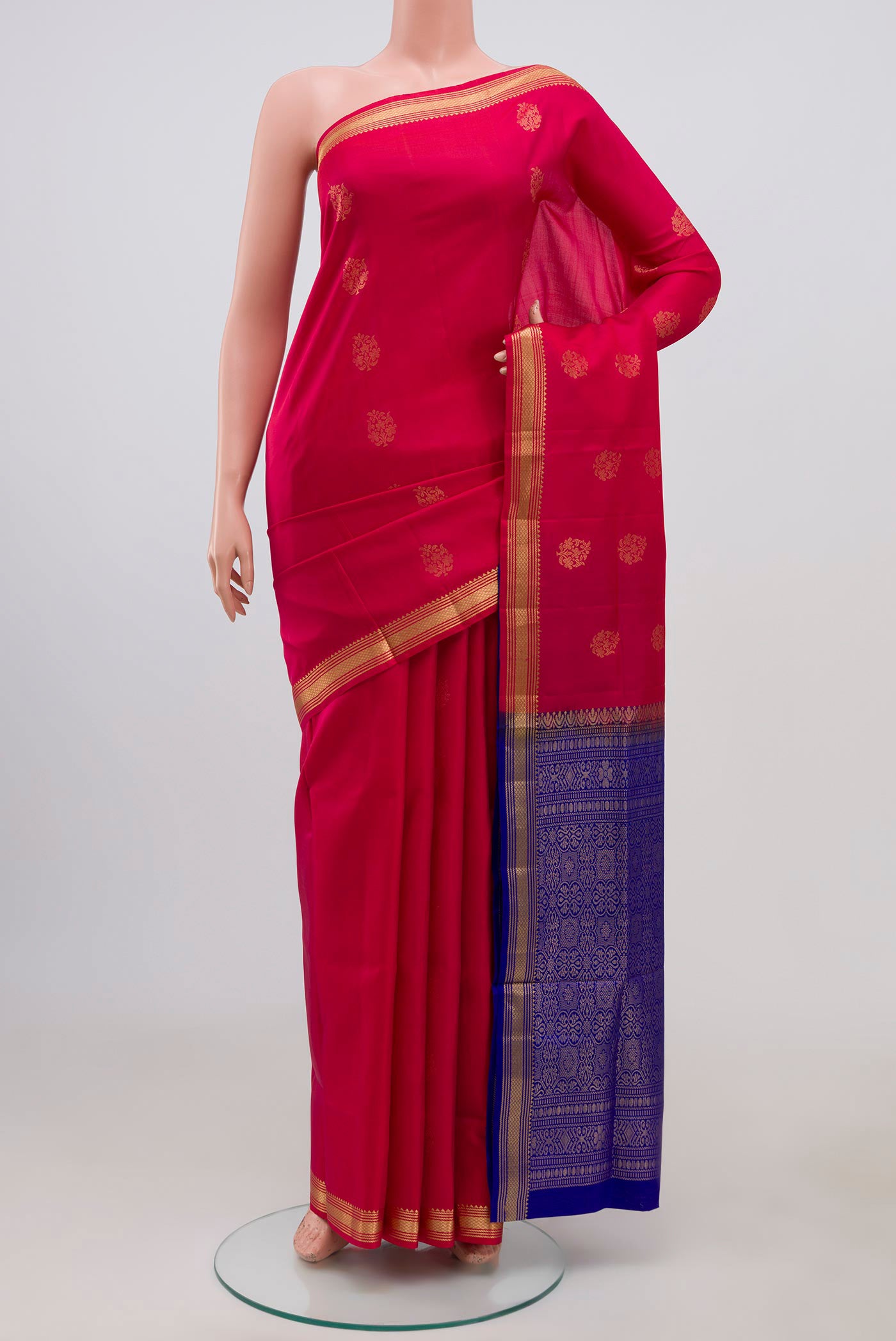 Pink Soft Silk Saree with Zari Butta on the body and Zari Border.  displayed on a mannequin