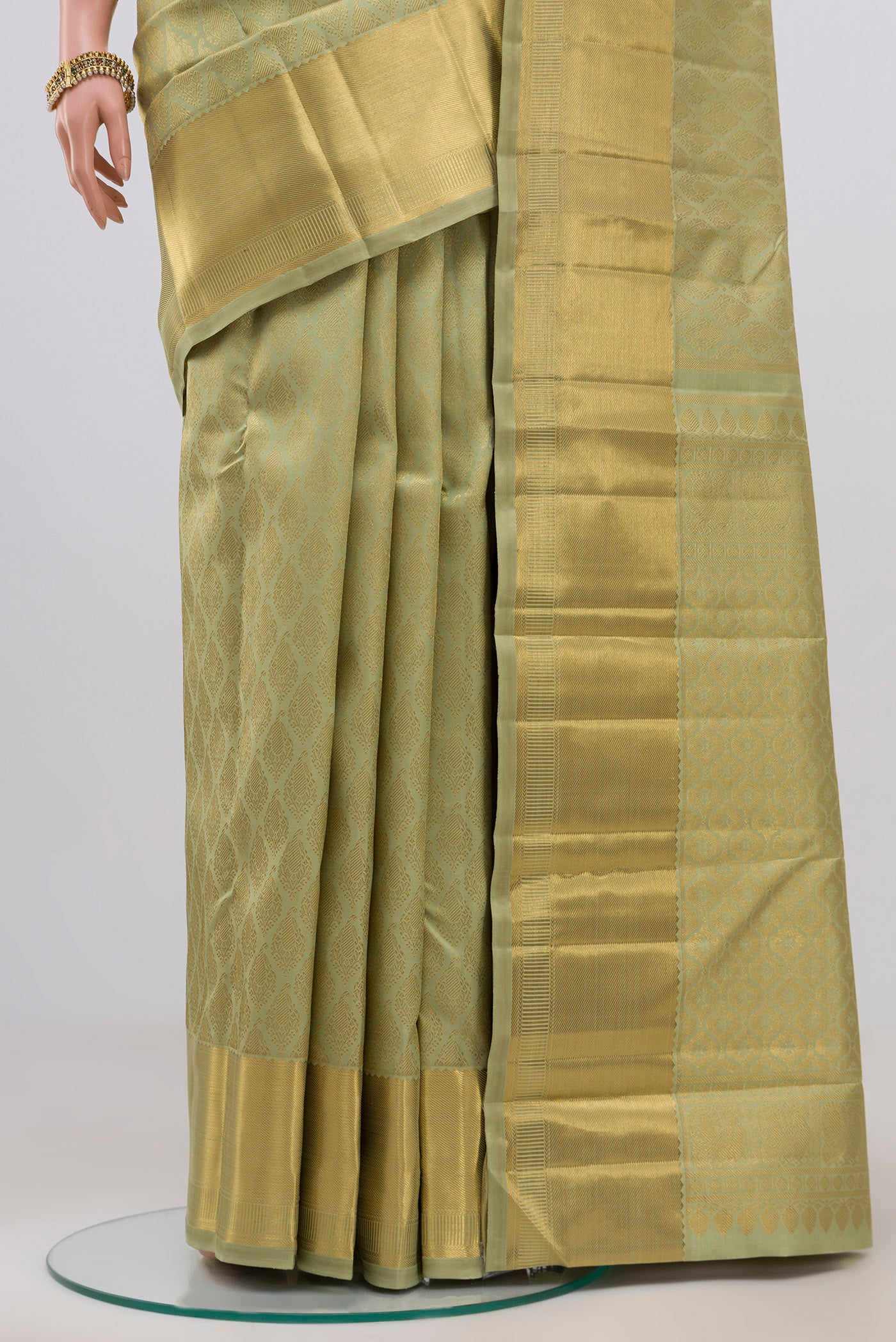 Pleats and pallu of Pure Silk Pure Zari Pista Green Kanjivaram Saree with Zari Brocade on the body and Zari Border. 