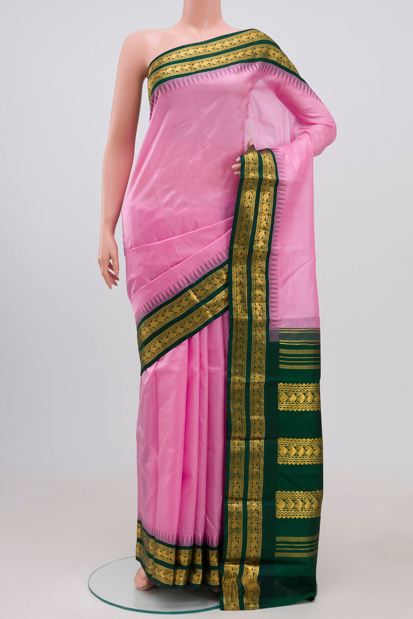 Pink Kanjivaram Silk Saree with Plain Body and Zari Border.  displayed on a mannequin
