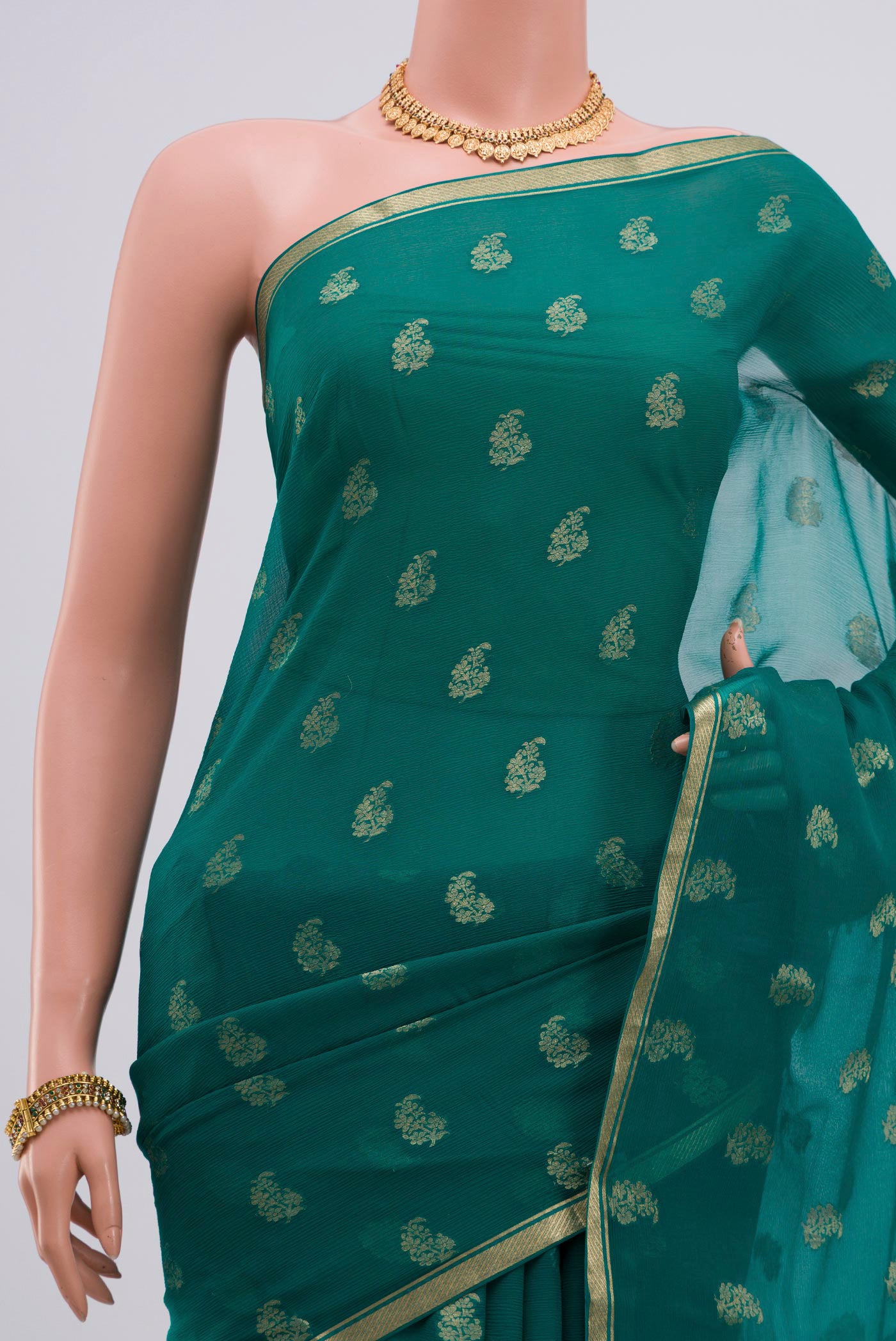Border image of Green Chiffon Saree with Zari Butta on the body and Zari Border. 