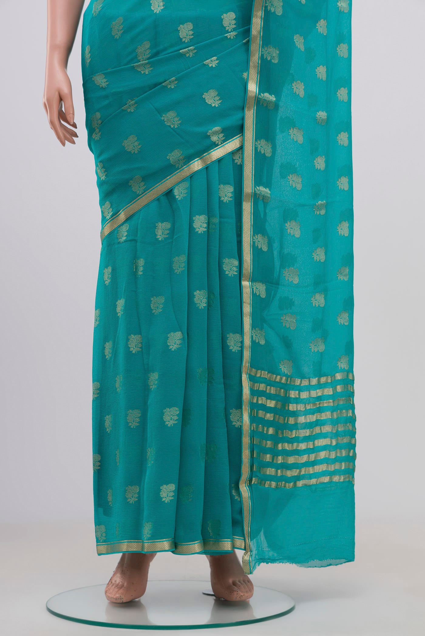 Pleats and pallu of Sky Blue Chiffon Saree with Zari Butta on the body and Zari Border. 