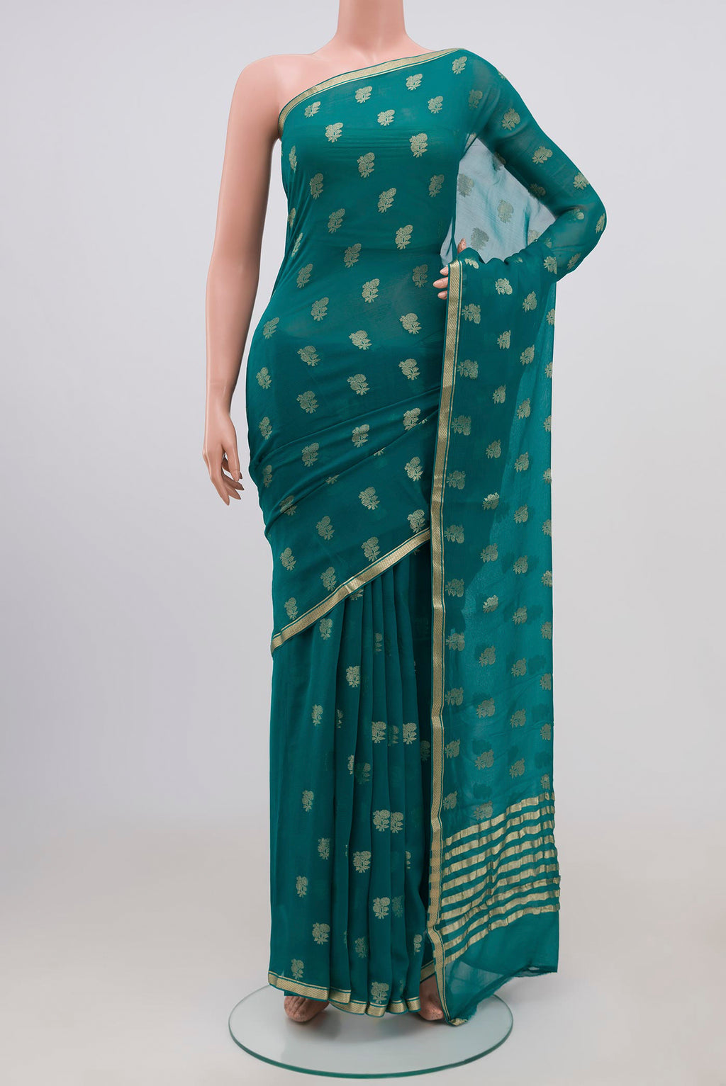 Maya Blue Chiffon Saree with Zari Butta on the body and Zari Border.  displayed on a mannequin