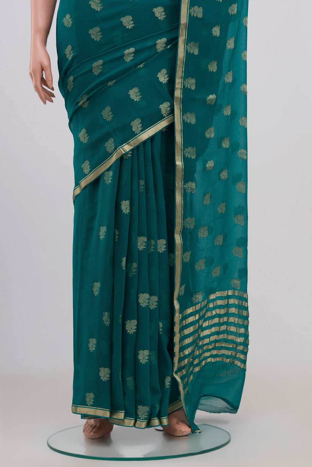 Pleats and pallu of Maya Blue Chiffon Saree with Zari Butta on the body and Zari Border. 