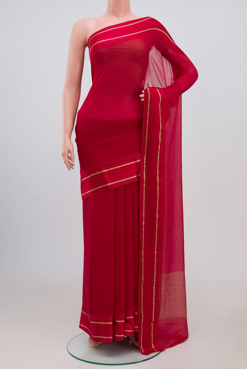 Red Chiffon Saree with Plain Body and Thin Zari Line.  displayed on a mannequin
