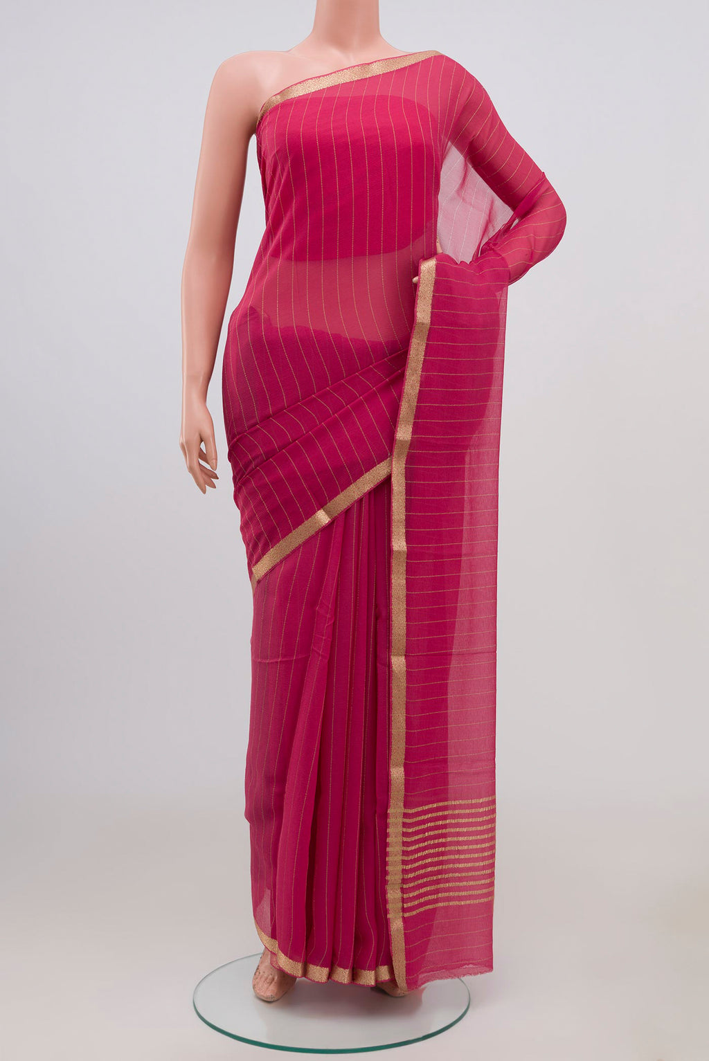 Pink Chiffon Saree with Stripes on the body and Zari Border.  displayed on a mannequin