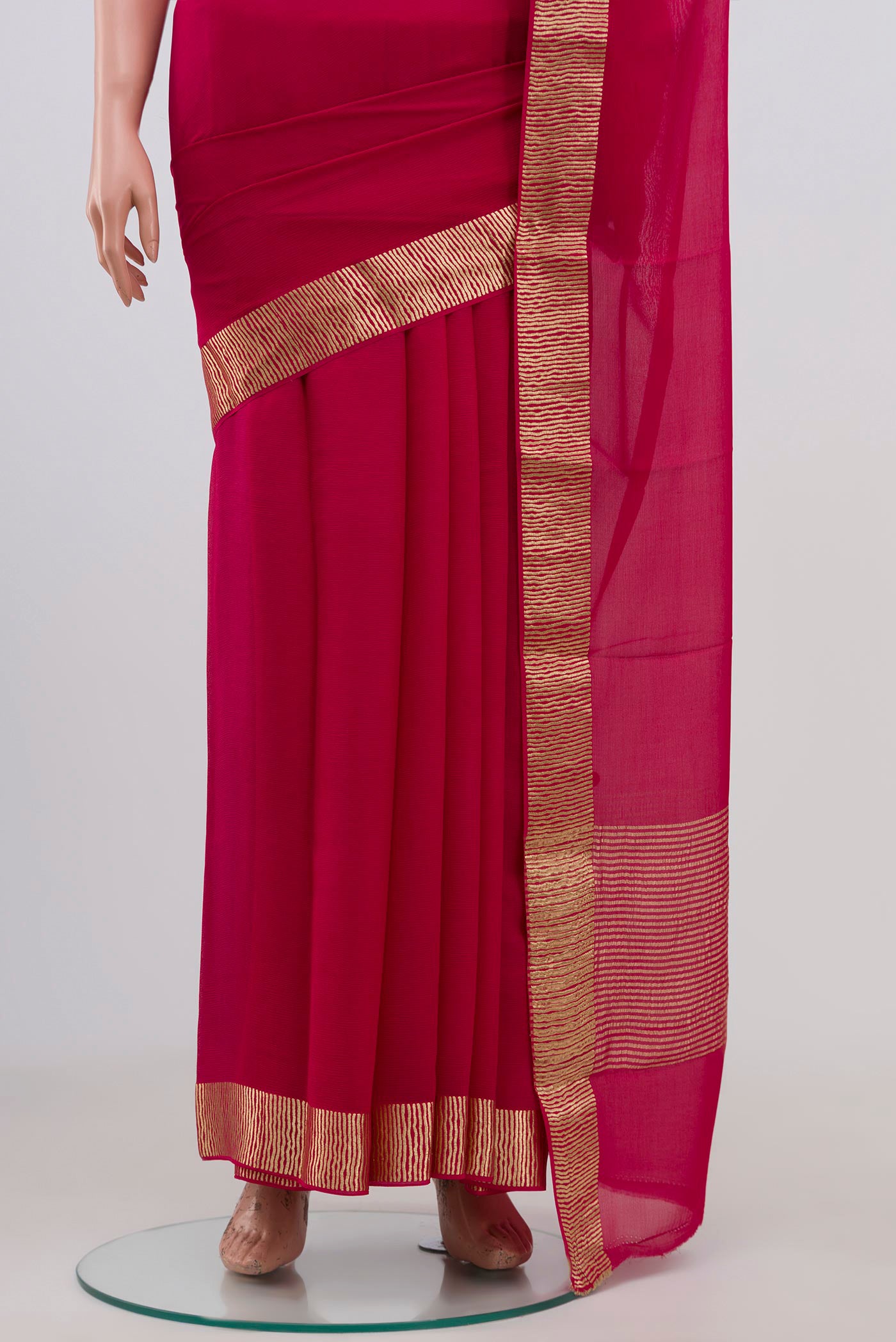 Pleats and pallu of Pink Chiffon Saree with Plain Body and Zari Border. 