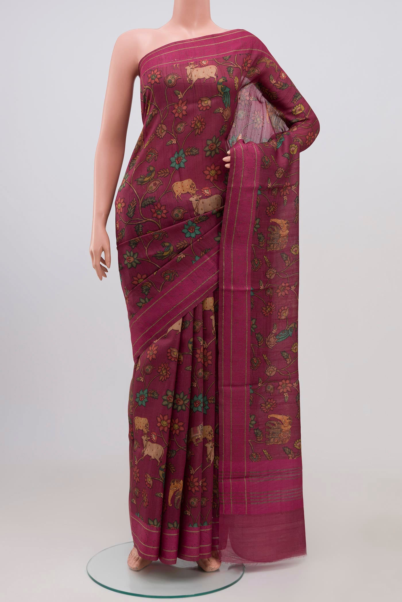 Purple Tussar Silk Saree with Floral Print on the body and Thin Zari Line.  displayed on a mannequin