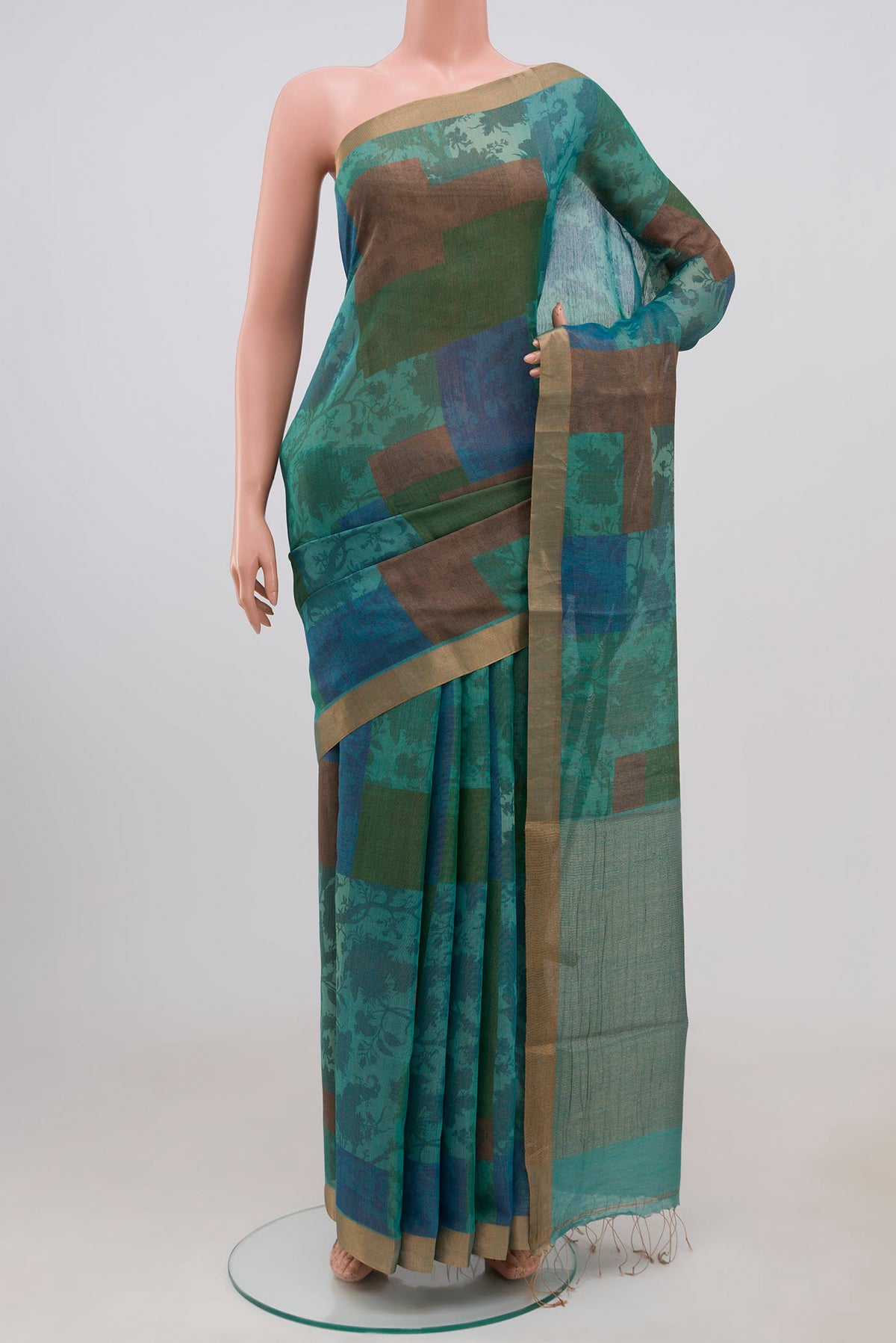 Multi Color Tussar Silk Saree with Fancy on the body and Thin Zari Line.  displayed on a mannequin