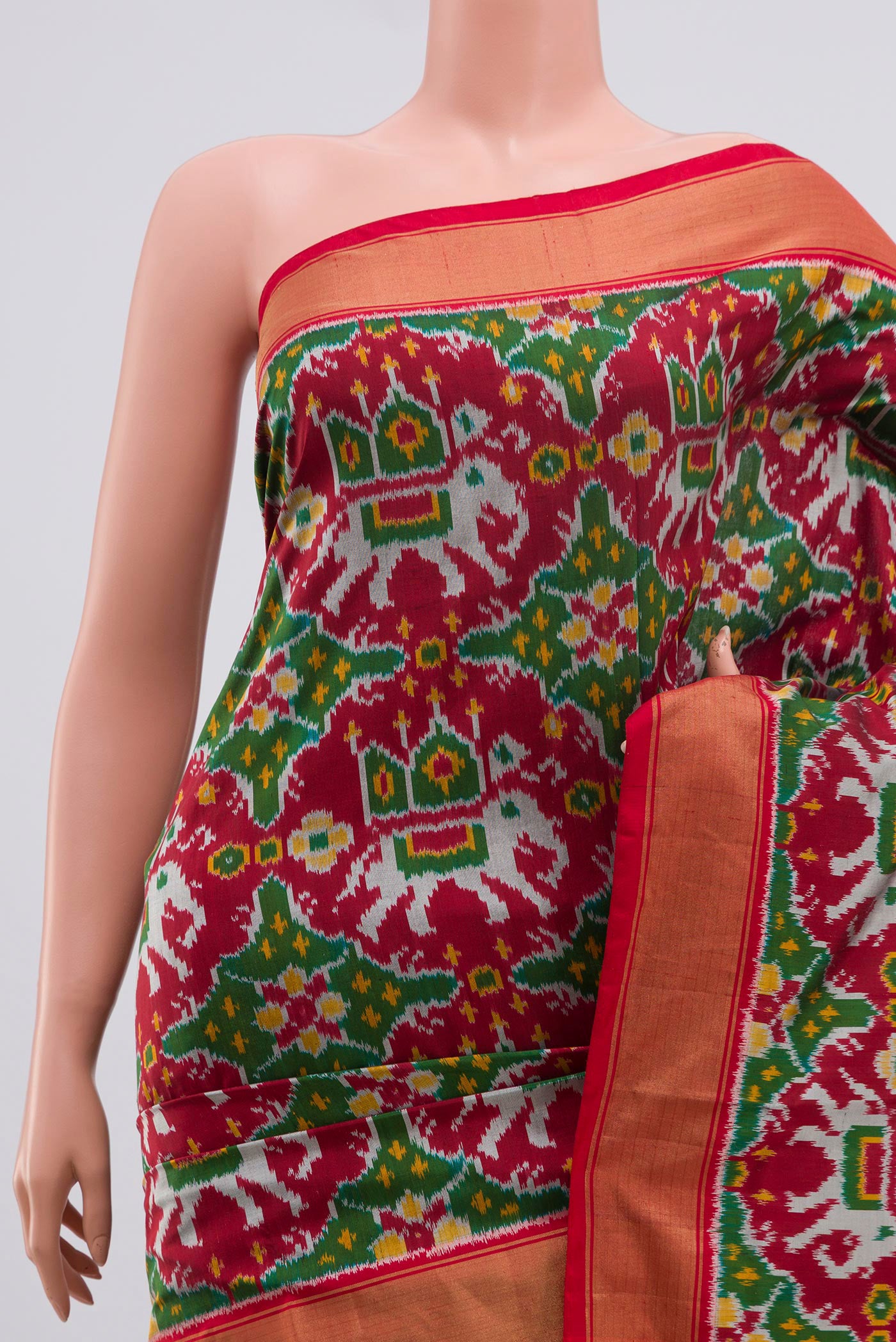 Border image of Maroon Pochampally Silk Saree with Ikat Print on the body and Zari Border. 