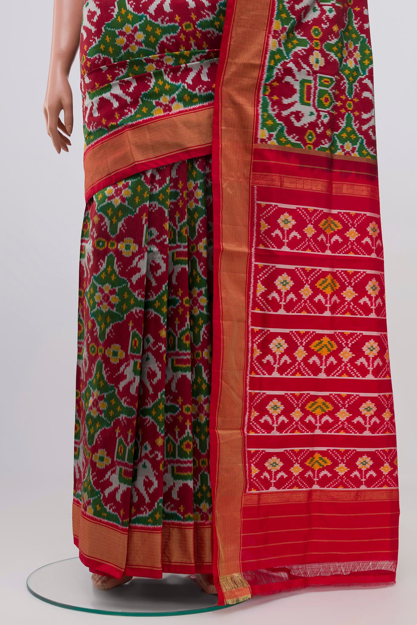 Pleats and pallu of Maroon Pochampally Silk Saree with Ikat Print on the body and Zari Border. 