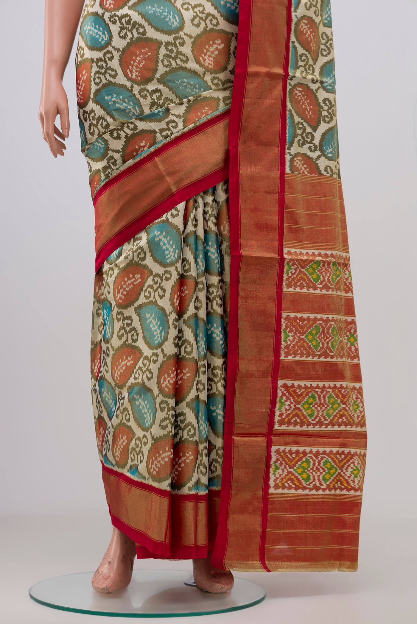 Pleats and pallu of Off White Pochampally Silk Saree with Ikat Print on the body and Zari Border. 