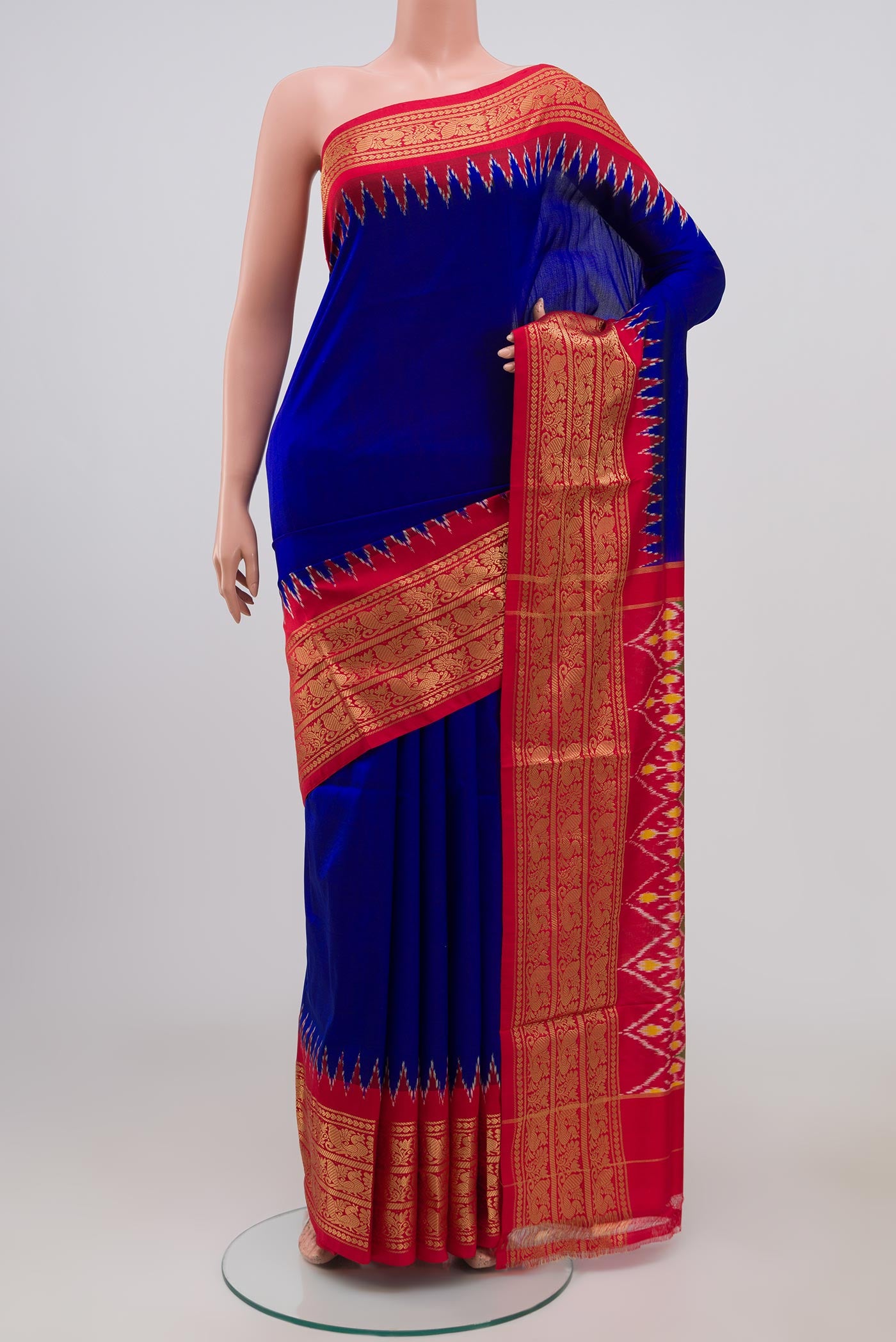 Blue Pochampally Silk Saree with Plain Body and Zari Border.  displayed on a mannequin