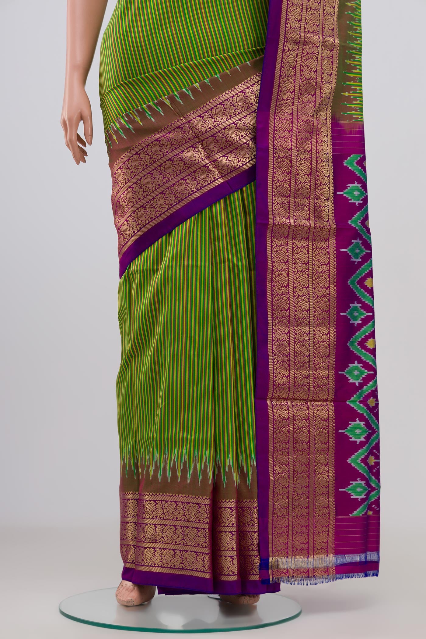 Pleats and pallu of Green Pochampally Silk Saree with Stripes on the body and Zari Border. 