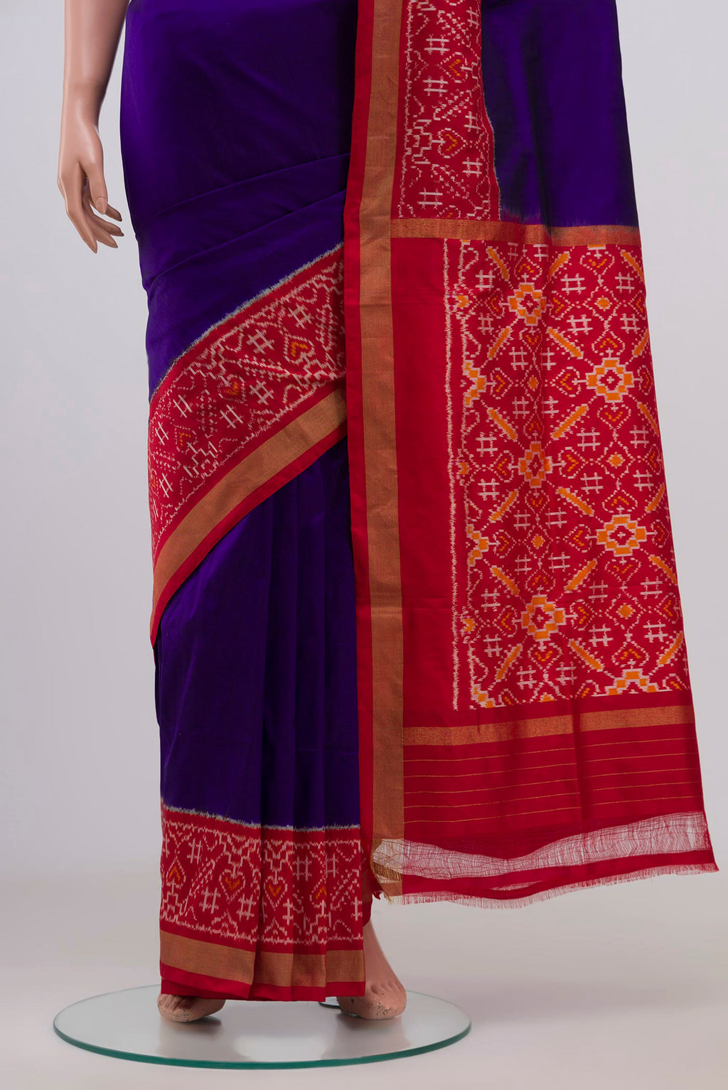 Pleats and pallu of Blue Pochampally Silk Saree with Plain Body and Ikat Border. 