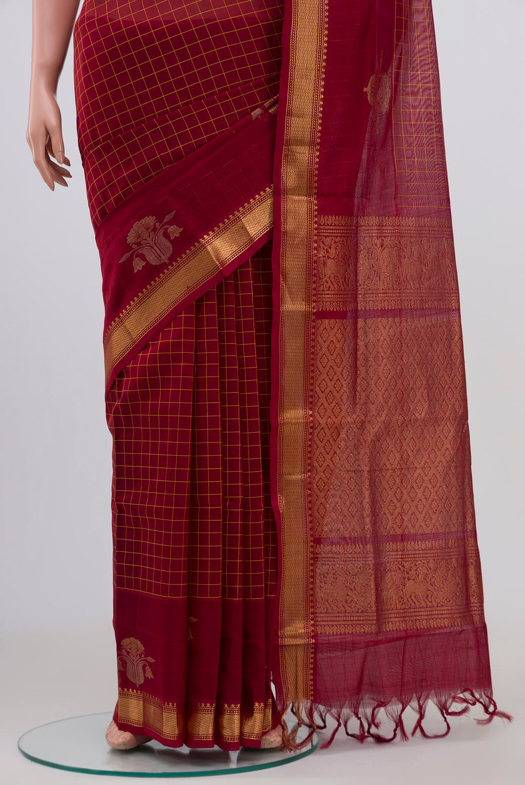 Pleats and pallu of Maroon Silk Cotton Saree with Checked design on the body and Zari Border. 