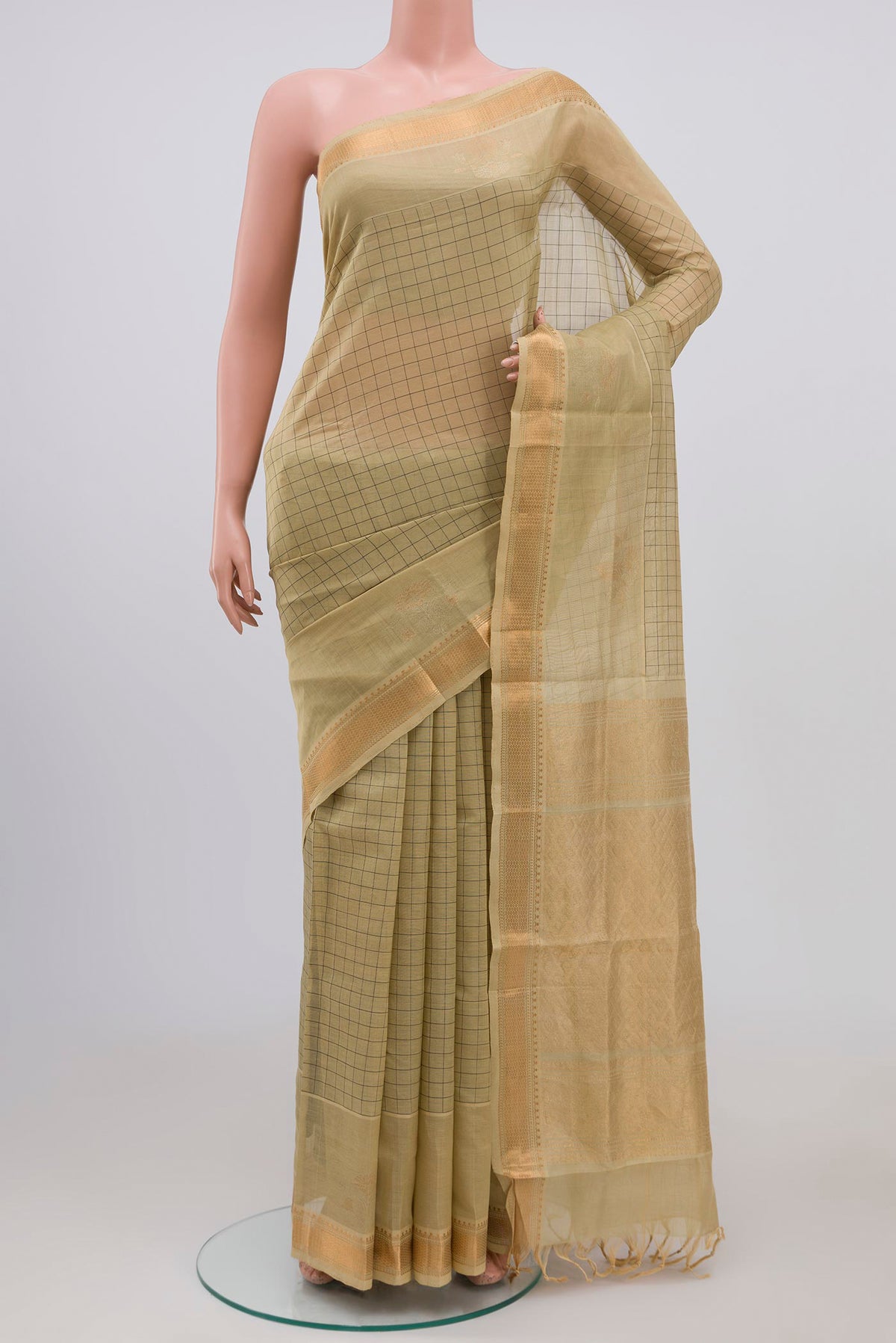 Beige Silk Cotton Saree with Checked design on the body and Zari Border.  displayed on a mannequin