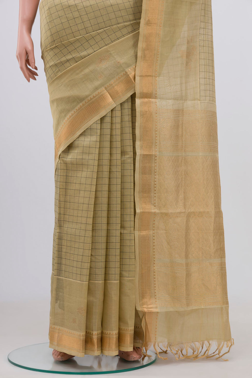 Pleats and pallu of Beige Silk Cotton Saree with Checked design on the body and Zari Border. 