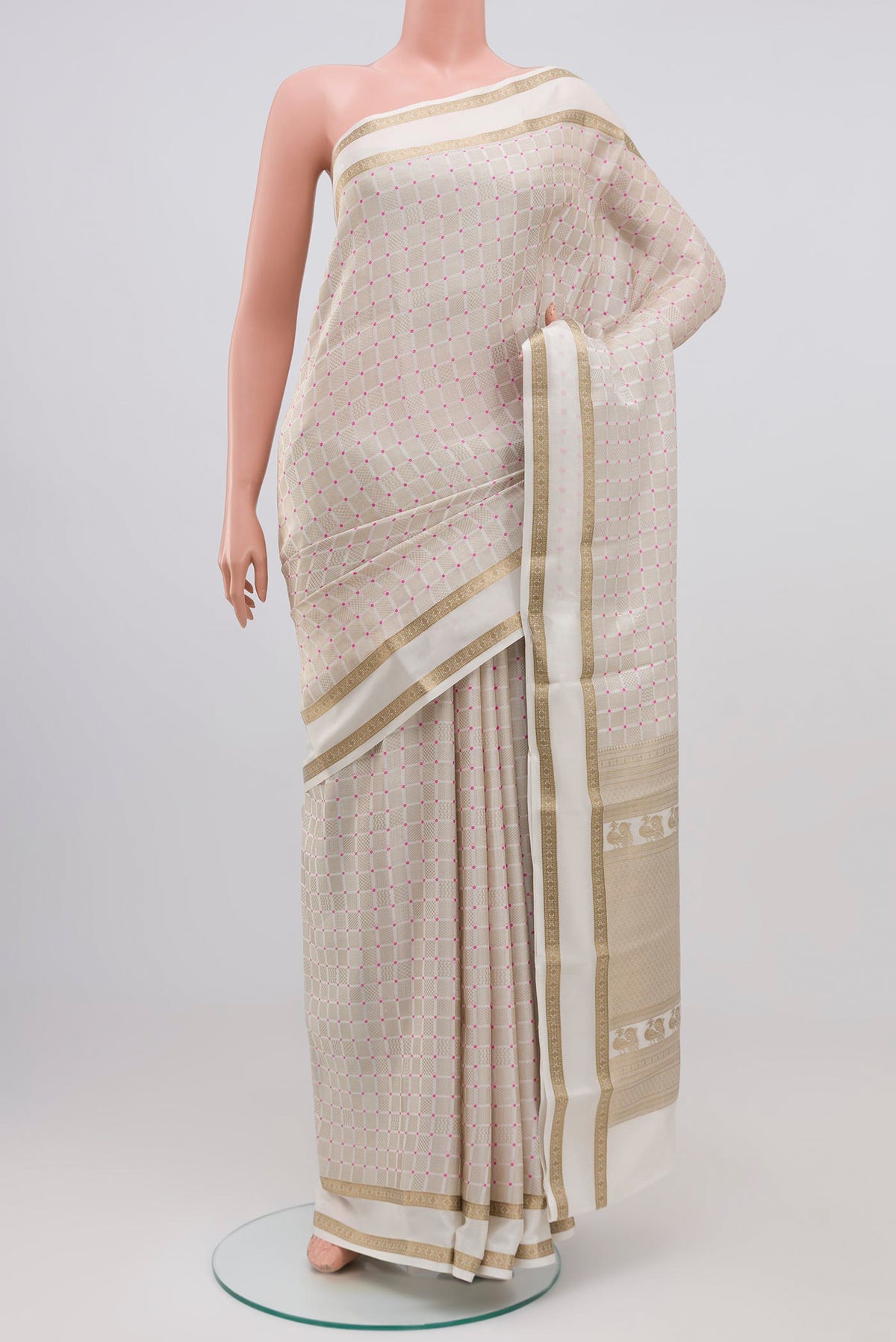 White Crepe Saree with Zari Brocade on the body and Zari Border.  displayed on a mannequin