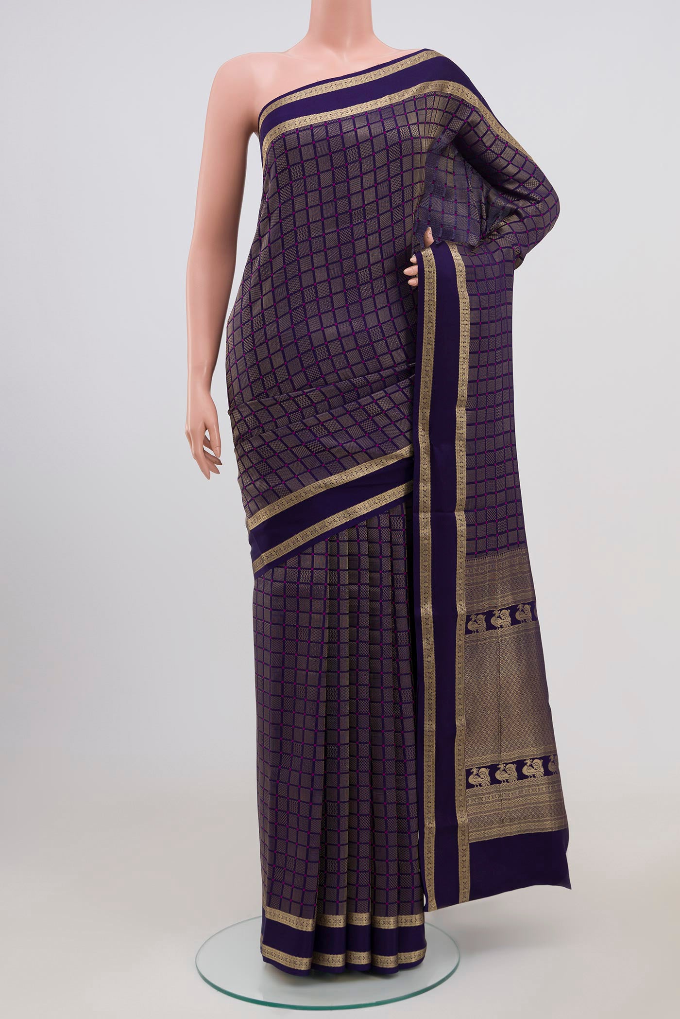 Navy Blue Mysore Crepe Saree with Checked design on the body and Zari Border.  displayed on a mannequin