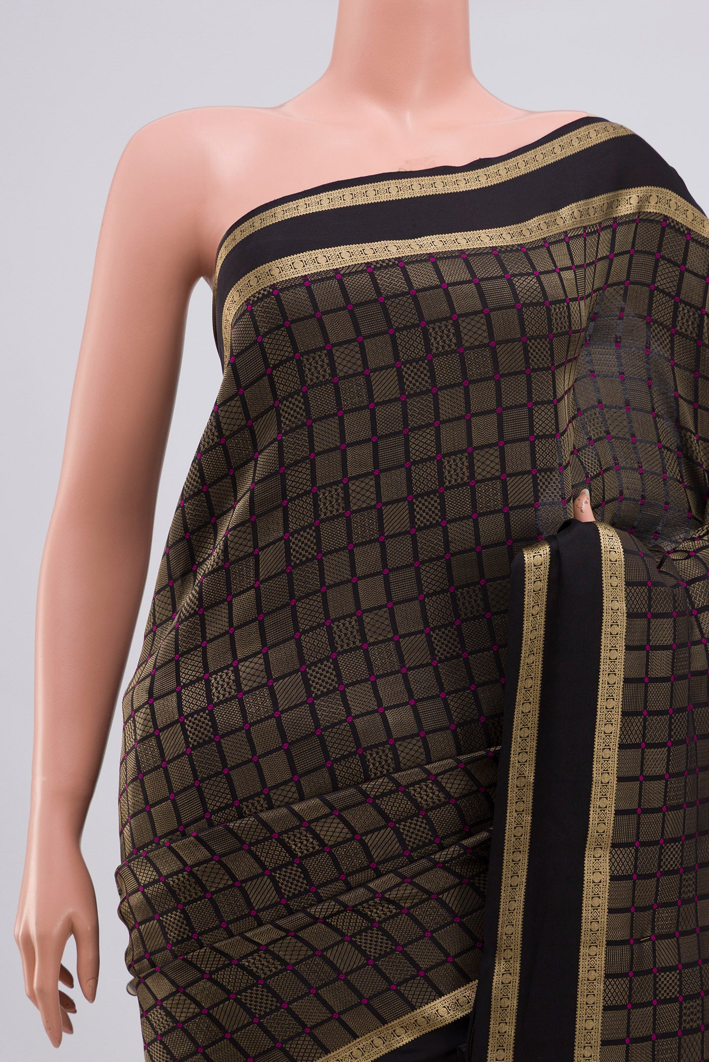 Border image of Black Crepe Saree with Zari Brocade on the body and Zari Border. 