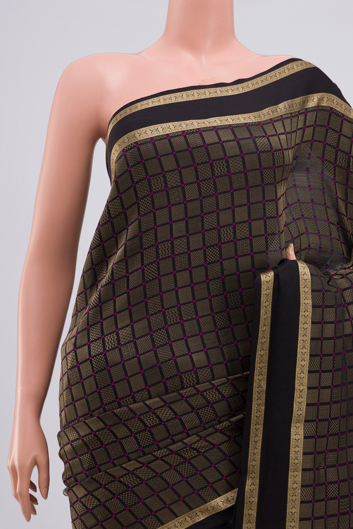 Border image of Black Crepe Saree with Zari Brocade on the body and Zari Border. 
