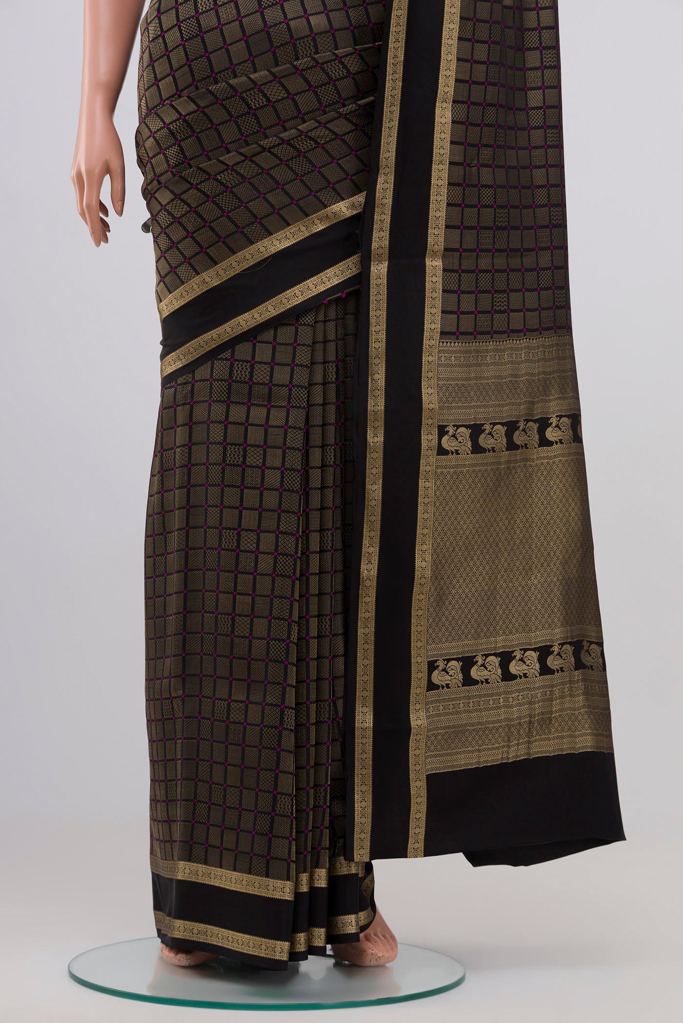Pleats and pallu of Black Crepe Saree with Zari Brocade on the body and Zari Border. 