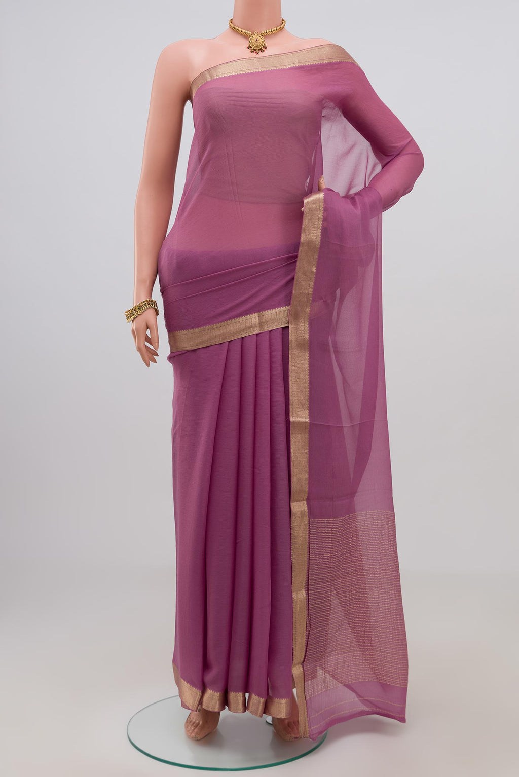 Lavender Chiffon Saree with Plain Body and Zari Border.  displayed on a mannequin