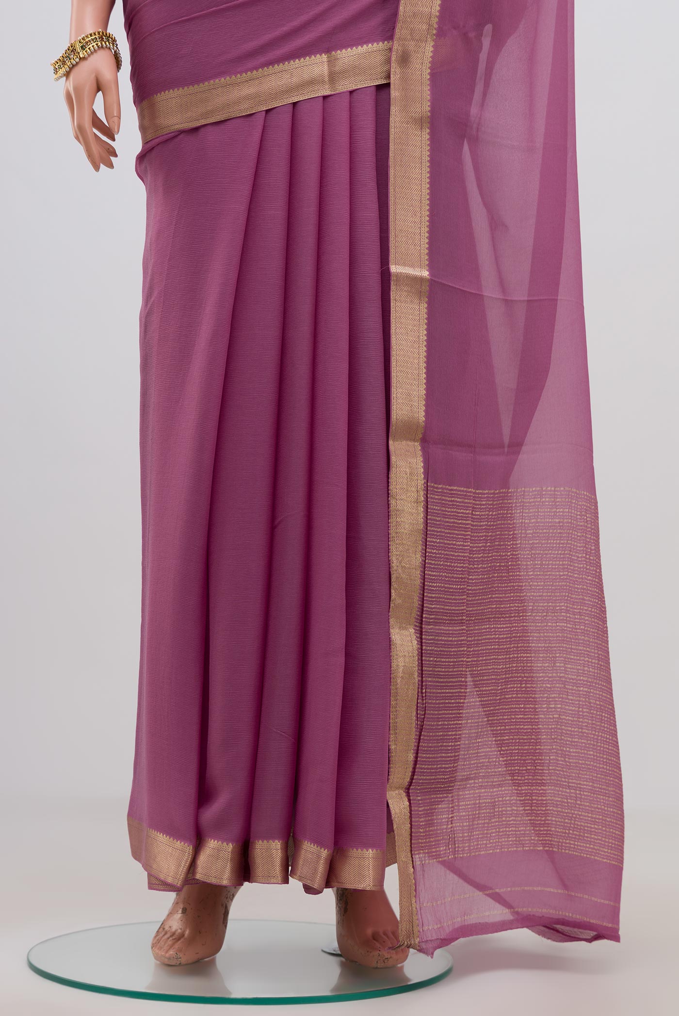 Pleats and pallu of Lavender Chiffon Saree with Plain Body and Zari Border. 