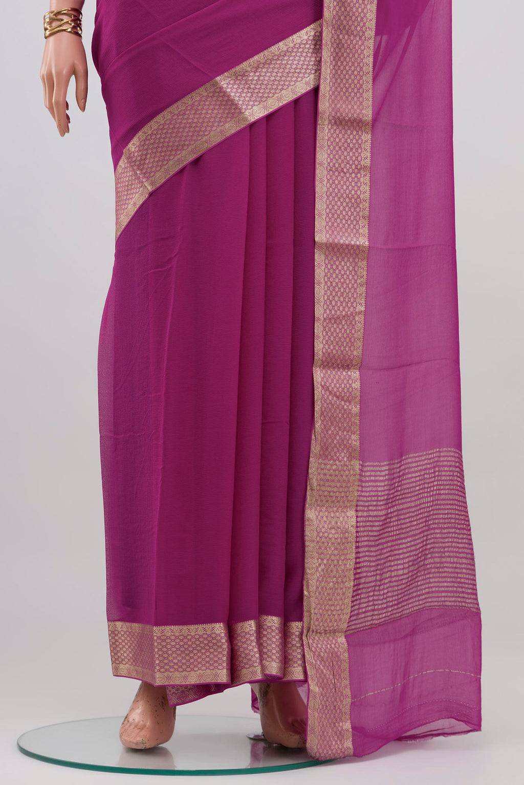 Pleats and pallu of Light Magenta Mysore Chiffon Saree with Plain Body and Zari Border. 