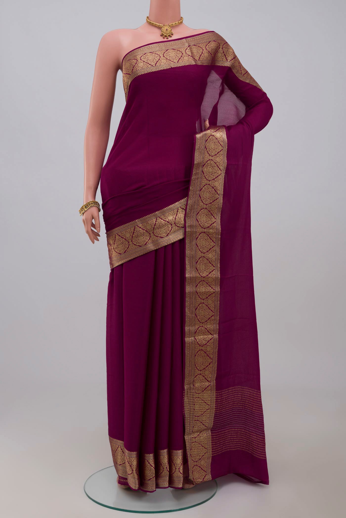 Purple Chiffon Saree with Plain Body and Zari Border.  displayed on a mannequin
