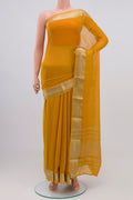 Mustard Georgette Saree with Zari Butta on the body and Zari Border.  displayed on a mannequin