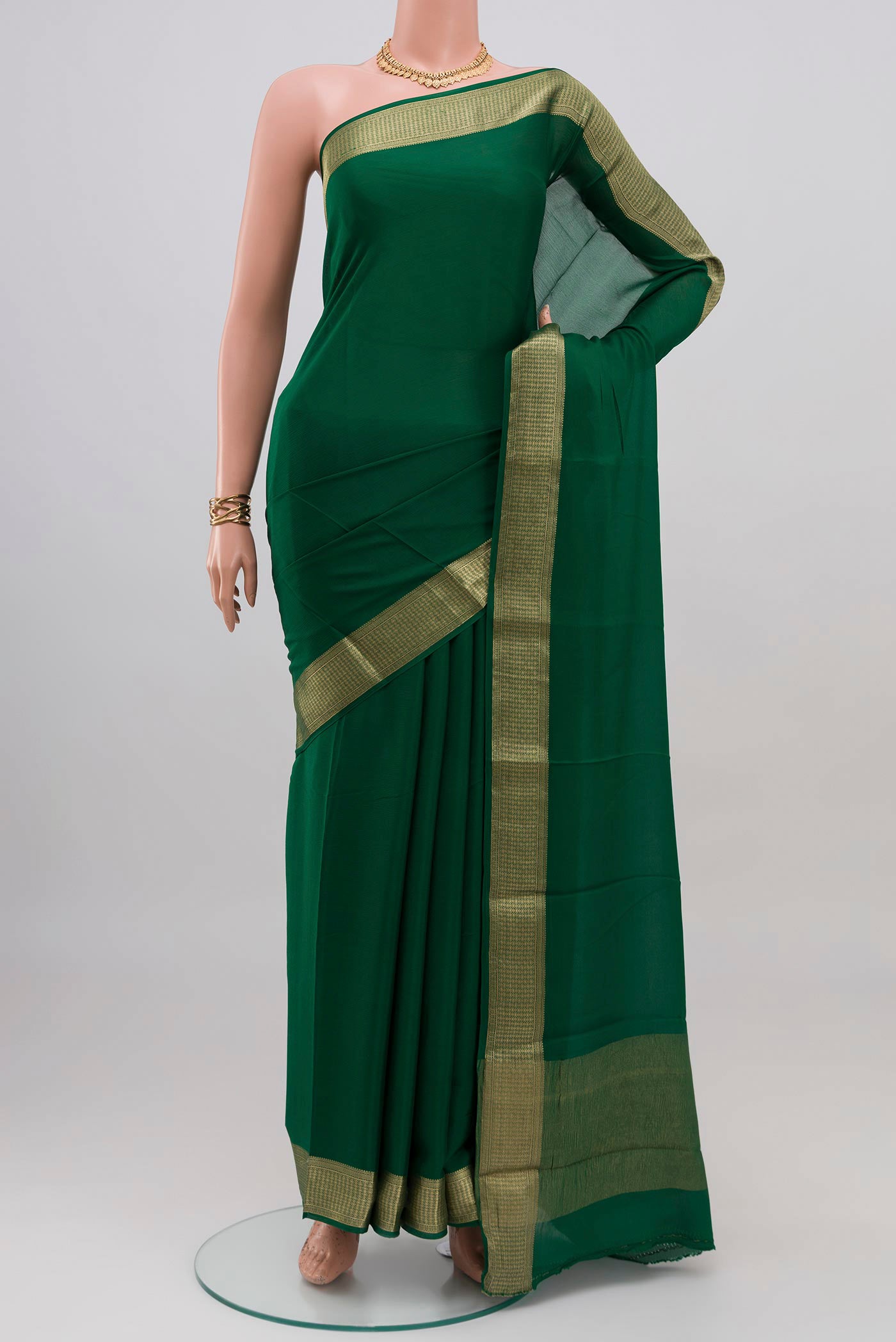 Green Mysore Chiffon Saree with Plain Body and Zari Border.  displayed on a mannequin