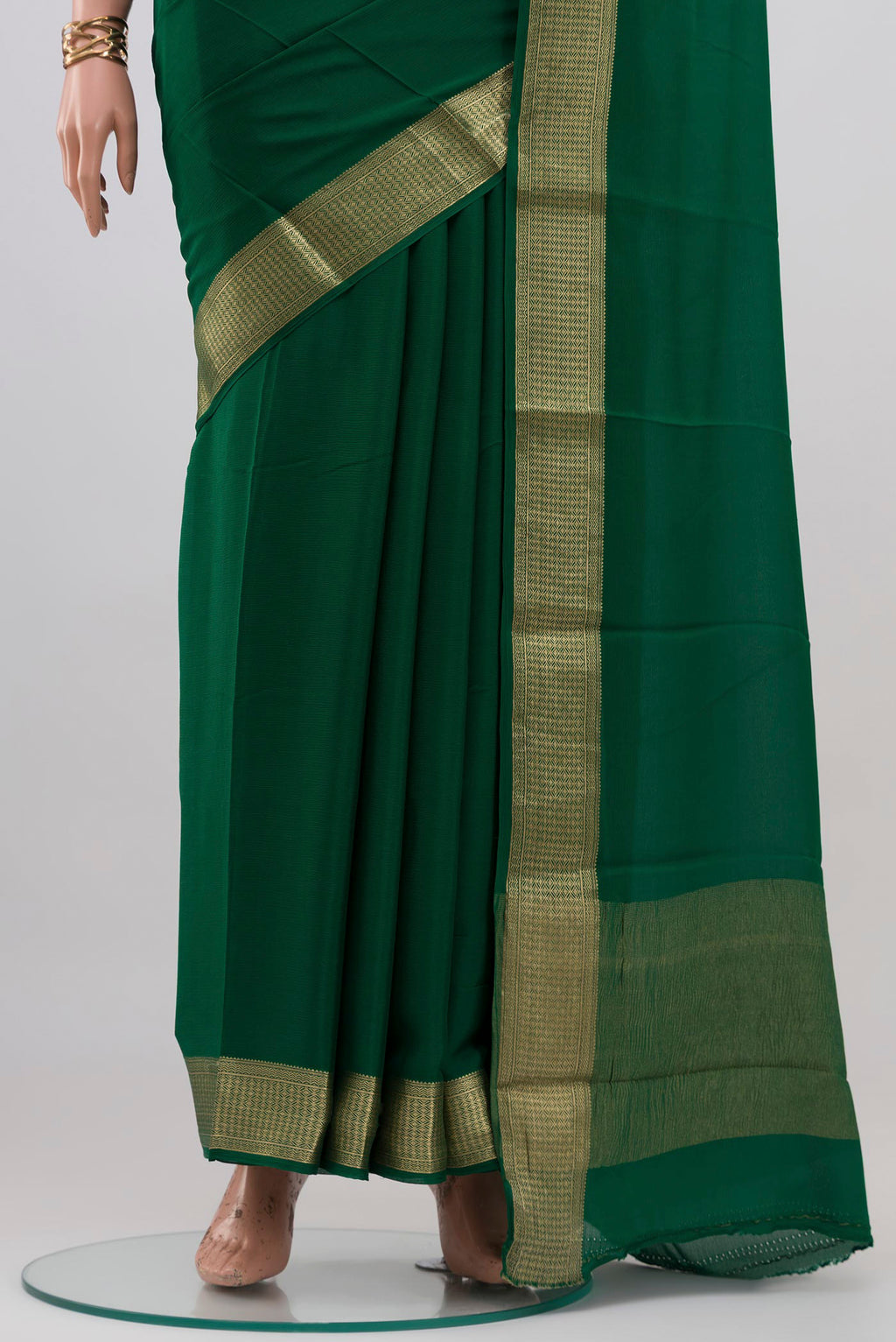 Pleats and pallu of Green Mysore Chiffon Saree with Plain Body and Zari Border. 