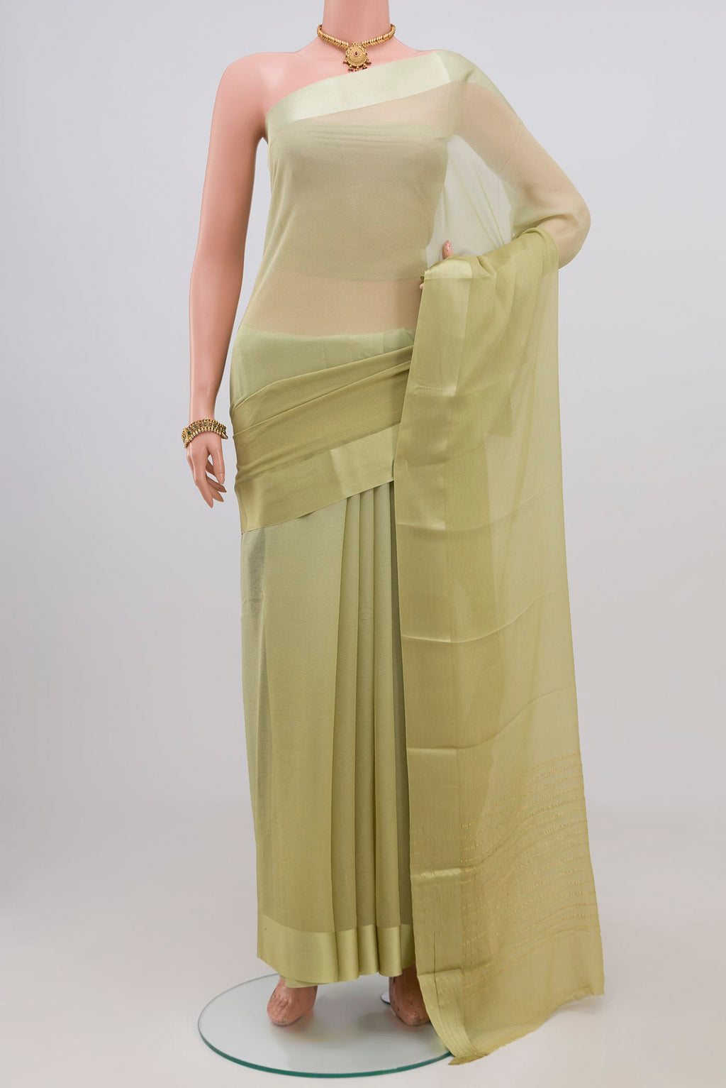 Light Green Chiffon Saree with Plain Body and Plain Border.  displayed on a mannequin