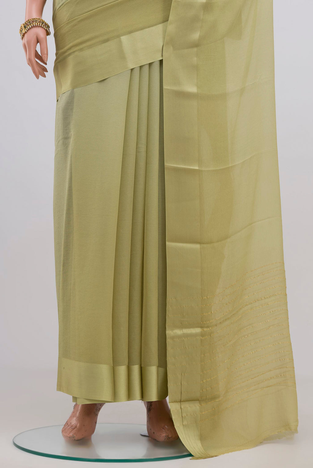 Pleats and pallu of Light Green Chiffon Saree with Plain Body and Plain Border. 