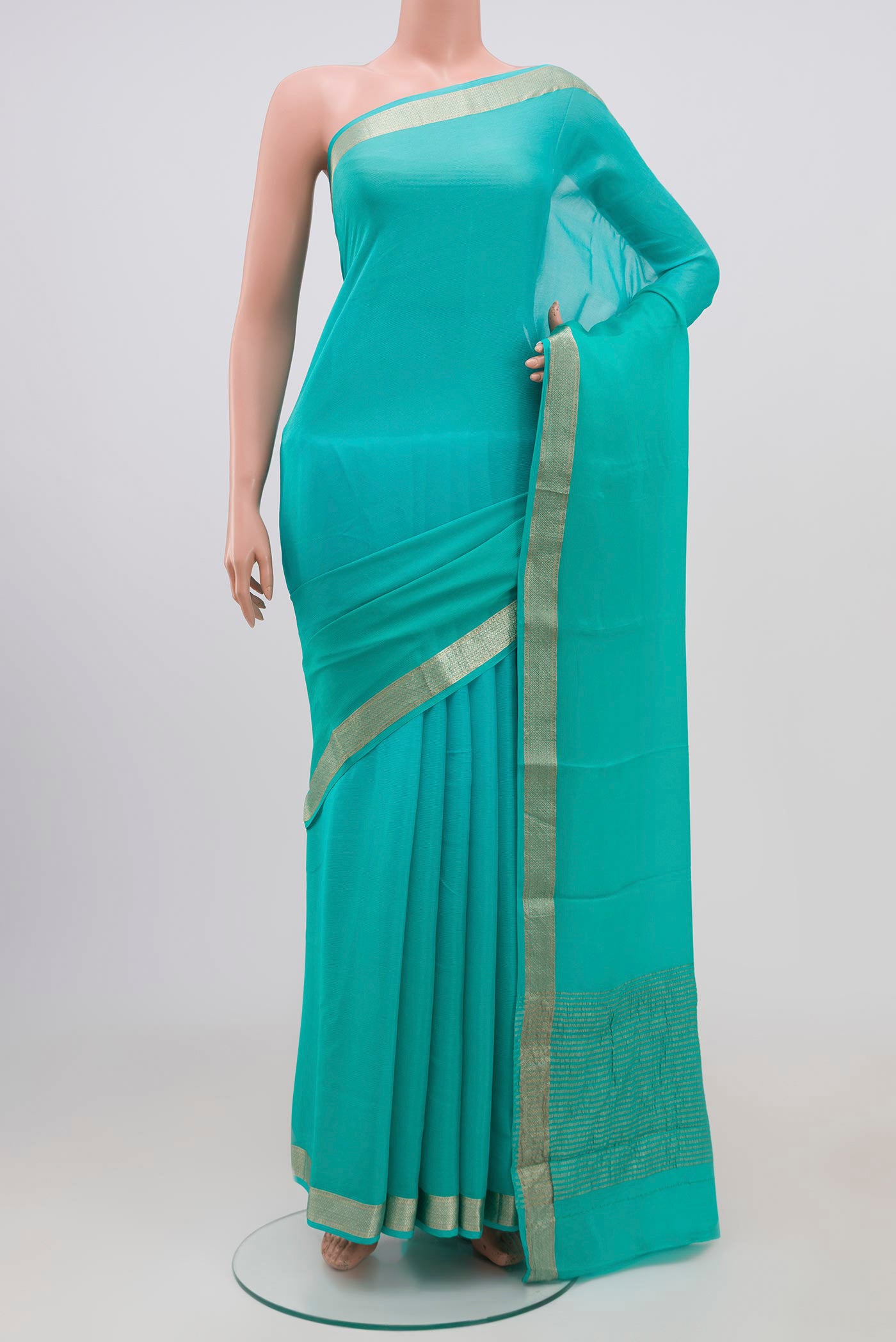 Sky Blue Chiffon Saree with Plain Body and Zari Border.  displayed on a mannequin