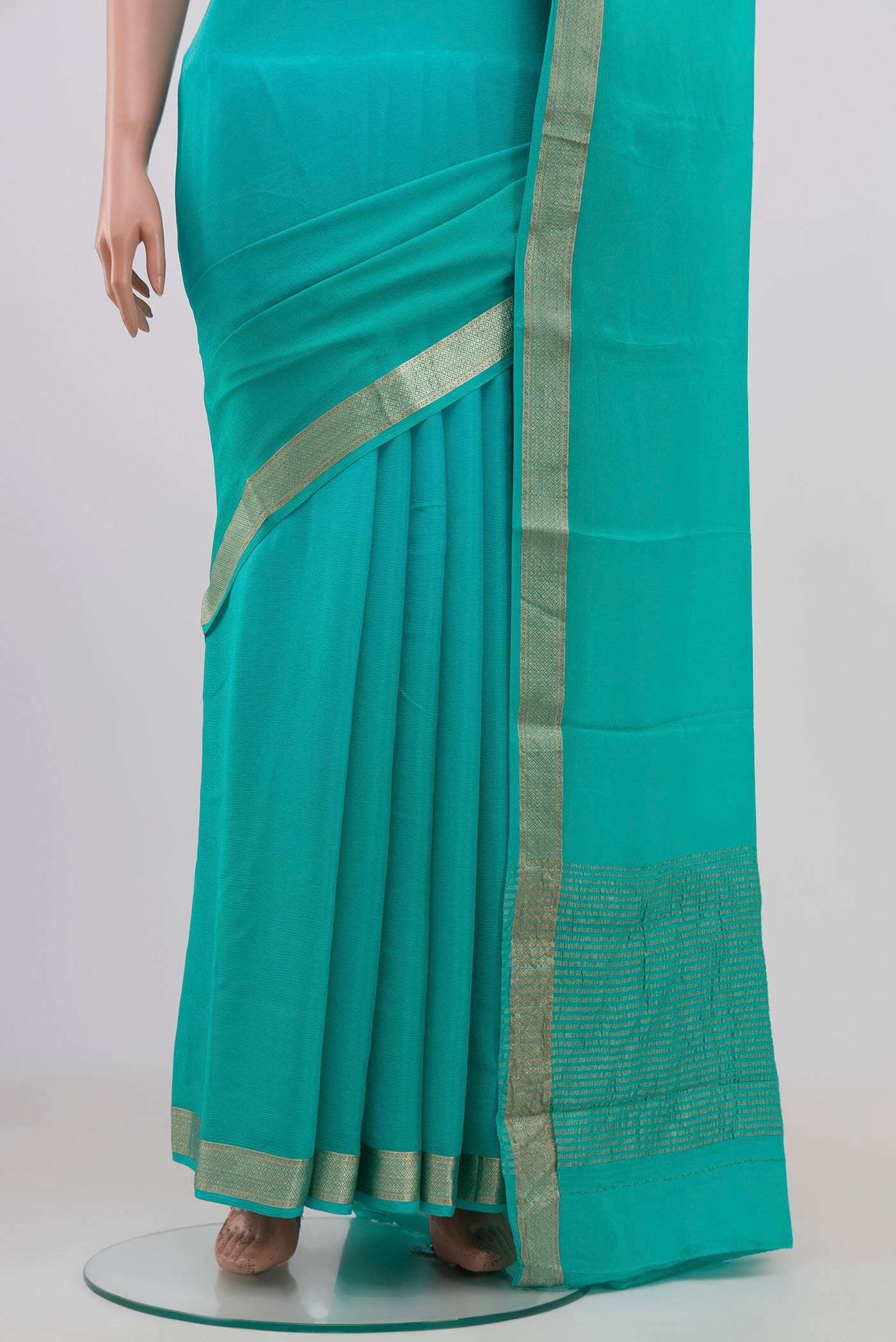 Pleats and pallu of Sky Blue Chiffon Saree with Plain Body and Zari Border. 