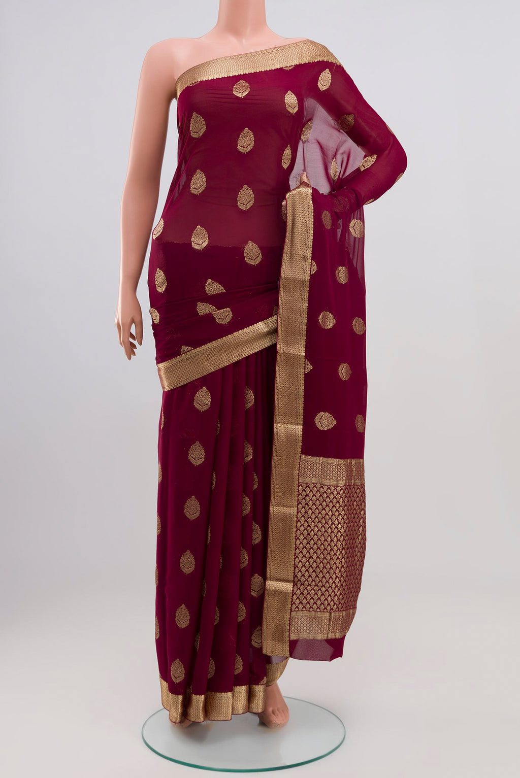 Purple Georgette Saree with Zari Butta on the body and Zari Border.  displayed on a mannequin